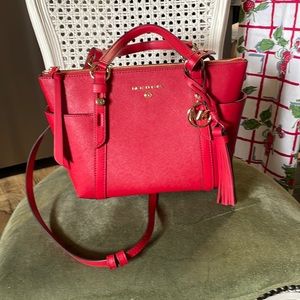 Michael Kors crimson purse with tags